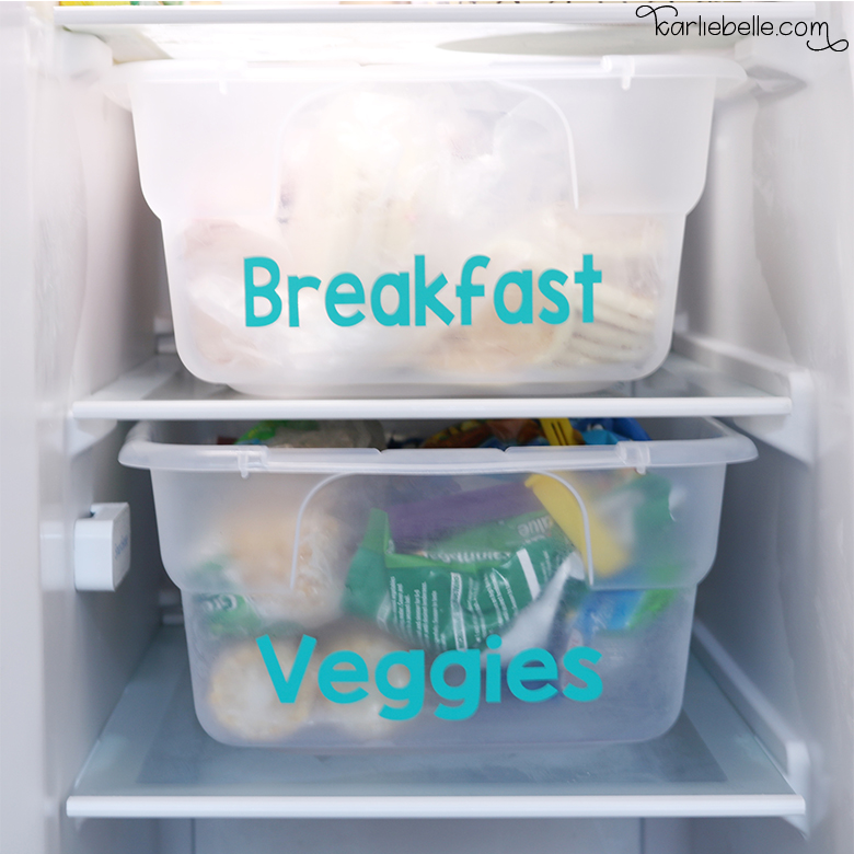 Freezer organization using plastic storage containers and organizing food into groups