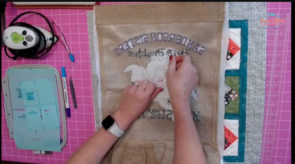 tearing away water soluble topper from embroidery halloween designs